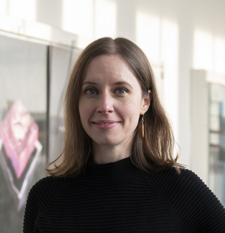 A picture of Kathrin Gerling, a white woman with shoulder-length hair wearing a black dress and a slight simle.